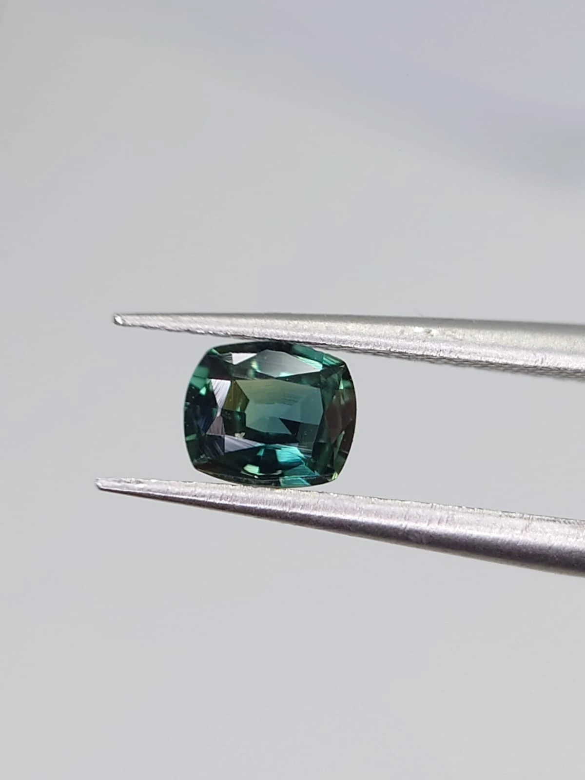 0.4ct Natural Bluish Green Sapphire from Nigeria — view 3